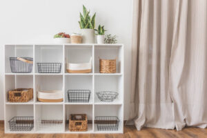 A modern, clutter-free storage shelf with organized baskets, showcasing the best storage solutions for a stress-free home.