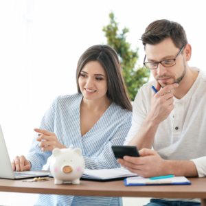 Couple comparing condo and detached home options for first-time buyers in the GTA