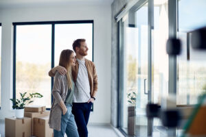 Couple moving into a new home with boxes